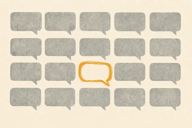 Grid of identical grey speech bubbles with one distinctive amber bubble standing out